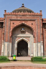 A mesmerizing view of architecture of main tomb at old fort from side lawn.