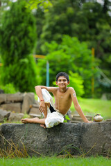 A indian priest child with holy water pot