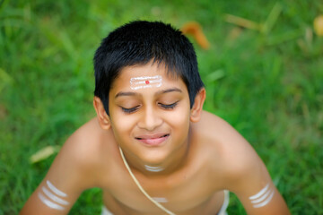 the portrait of indian priest child
