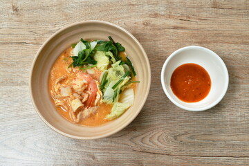boiled seafood sukiyaki in soup with sauce