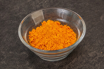 Tumeric powder in the bowl