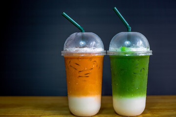 A close-up view of the drinks put into the cup, (iced tea, cocoa, chocolate) with pearls, is a popular menu in cafes and restaurants.