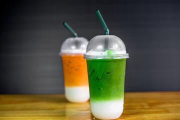 A close-up view of the drinks put into the cup, (iced tea, cocoa, chocolate) with pearls, is a popular menu in cafes and restaurants.