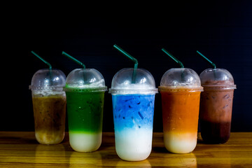 A close-up view of the drinks put into the cup, (iced tea, cocoa, chocolate) with pearls, is a popular menu in cafes and restaurants.