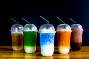 A close-up view of the drinks put into the cup, (iced tea, cocoa, chocolate) with pearls, is a popular menu in cafes and restaurants.