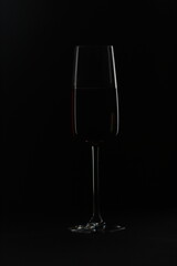 a glass of wine isolated on black background