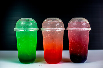 A close-up view of the drinks put into the cup, (iced tea, cocoa, chocolate) with pearls, is a popular menu in cafes and restaurants.