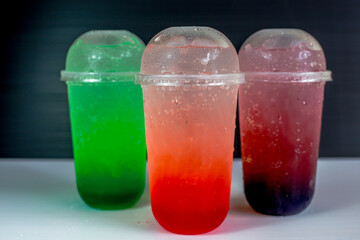 A close-up view of the drinks put into the cup, (iced tea, cocoa, chocolate) with pearls, is a popular menu in cafes and restaurants.