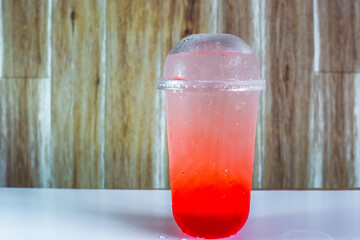 A close-up view of the drinks put into the cup, (iced tea, cocoa, chocolate) with pearls, is a popular menu in cafes and restaurants.