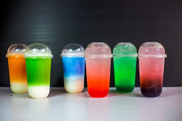 A close-up view of the drinks put into the cup, (iced tea, cocoa, chocolate) with pearls, is a popular menu in cafes and restaurants.