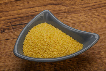 Raw cous cous heap in the bowl