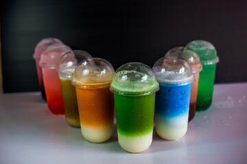 A close-up view of the drinks put into the cup, (iced tea, cocoa, chocolate) with pearls, is a popular menu in cafes and restaurants.