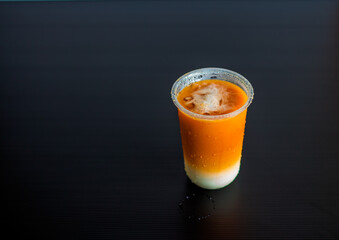 A close-up view of the drinks put into the cup, (iced tea, cocoa, chocolate) with pearls, is a popular menu in cafes and restaurants.