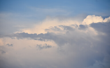 Naklejka na ściany i meble Blue sky above a layer of clouds