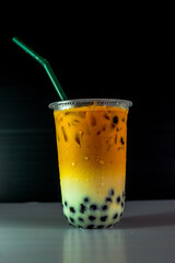 A close-up view of the drinks put into the cup, (iced tea, cocoa, chocolate) with pearls, is a popular menu in cafes and restaurants.