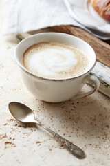 Coffee with milk on bright stone background. Close up.	
