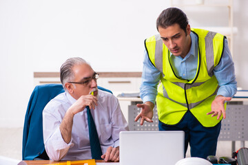 Two male architects working in the office