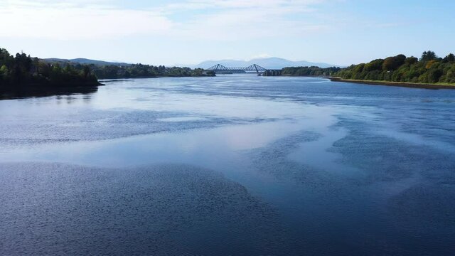 aerial view of the falls of lora near connel, connel bridge and oban in the argyll region of the highlands of scotland during a clear blue autumn day