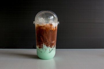 A close-up view of the drinks put into the cup, (iced tea, cocoa, chocolate) with pearls, is a popular menu in cafes and restaurants.