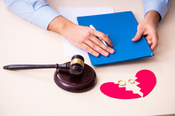 Young man in courthouse in divorcing concept