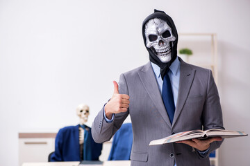 Funny business meeting with devil and skeletons