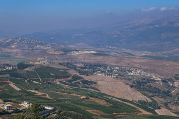 View of Southern Lebanon and Northern Israel with the concrete wall built along the international border, as seen from kibbutz Misgav-Am lookout point, Upper Galilee, Israel.