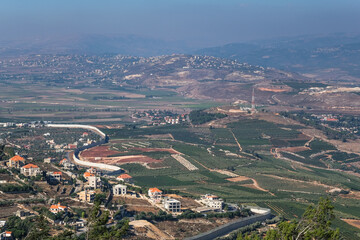 View of Southern Lebanon and Northern Israel with the concrete wall built along the international border, as seen from kibbutz Misgav-Am lookout point, Upper Galilee, Israel.