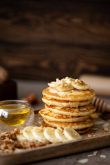 small pancakes with banana, walnuts and honey