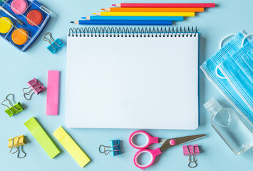 School supplies, colors, notebooks and items for the prevention of coronavirus.