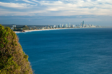Fototapeta na wymiar Ocean coastline with cityscape in sunny day, burleigh heads, queensland, Australia