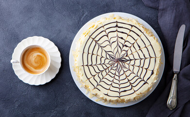 Traditional Hungarian Esterhazy cake, torte with cup of coffee. Grey background. Top view.