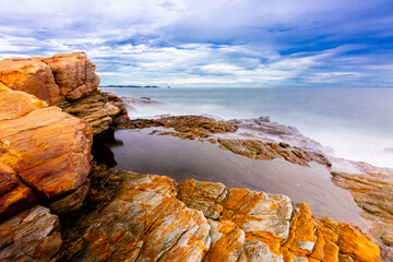 The sea spray hitting the rocks in the afternoon at Khao Laemya National Park Thailand.