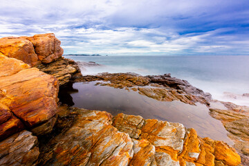 The sea spray hitting the rocks in the afternoon at Khao Laemya National Park Thailand.