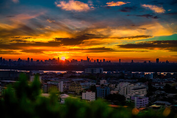 The background of the Wat Pa Kham Charoen is a beautiful old church with a Buddhist statue and a tree-lined temple, with tourists and travelers always making merit in Udon Thani, Thailand.