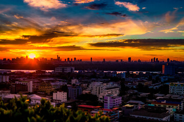 Blurred abstract background view of the night sky, ambience surrounded by condominiums and street lighting, dispersion of accommodation in the capital.