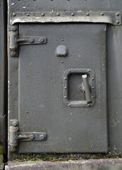 Small gray door to an armored bunker