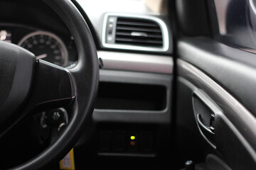Fototapeta na wymiar Steering wheel right side. The past of steering wheel. Automotive Interior, Steering Wheel Close up.