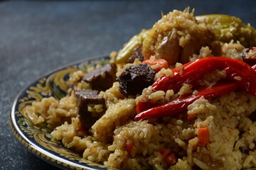 Uzbek cuisine (food) pilaf (plov palov osh) salad achichuk (achuchuk).Mutton,rice,carrots,vegetable oil,raisins,onion,turmeric,black pepper,cumin