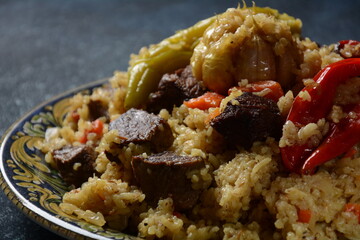 Uzbek cuisine (food) pilaf (plov palov osh) salad achichuk (achuchuk).Mutton,rice,carrots,vegetable oil,raisins,onion,turmeric,black pepper,cumin