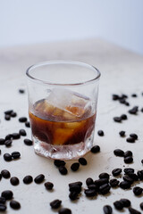 Ice coffee Americano and Coffee Bean Day light 