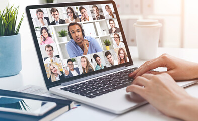 Woman hands on laptop during video conference