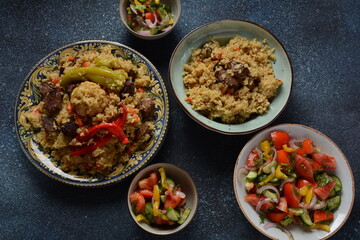 Uzbek cuisine (food) pilaf (plov palov osh) salad achichuk (achuchuk).Mutton,rice,carrots,vegetable oil,raisins,onion,turmeric,black pepper,cumin