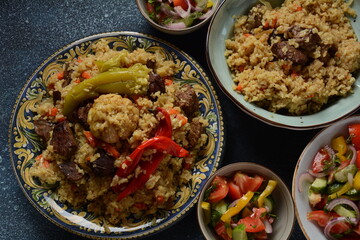 Uzbek cuisine (food) pilaf (plov palov osh) salad achichuk (achuchuk).Mutton,rice,carrots,vegetable oil,raisins,onion,turmeric,black pepper,cumin