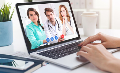 Woman having video chat with doctors