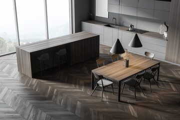 Gray and wooden kitchen with table, top view