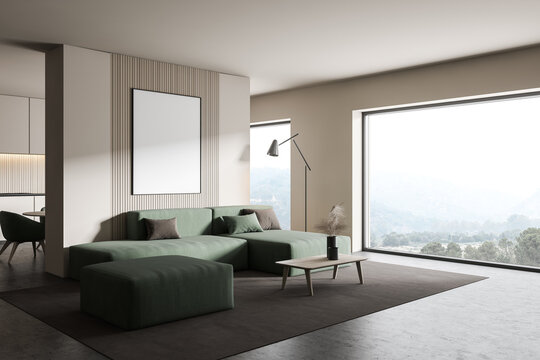 White living room corner, green sofa and poster