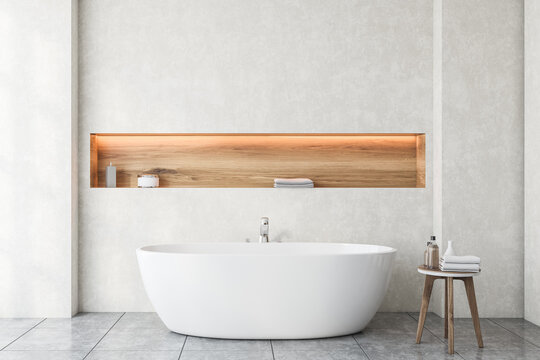White bathroom interior with tub