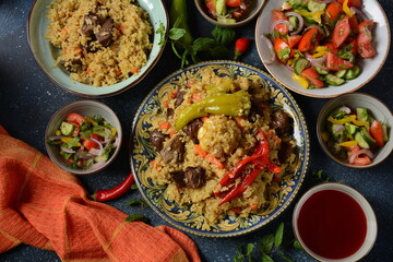 Uzbek cuisine (food) pilaf (plov palov osh) salad achichuk (achuchuk).Mutton,rice,carrots,vegetable oil,raisins,onion,turmeric,black pepper,cumin