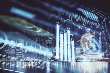 Double exposure of technology theme hologram and cityscape background. Concept of Hightech.