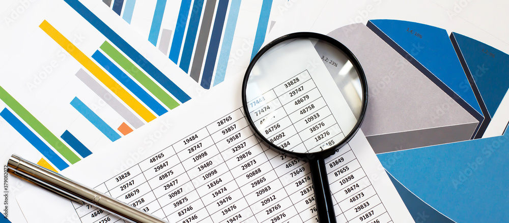 Poster many charts and graphs with pen and magnifier. concept image of data gathering and statistical worki